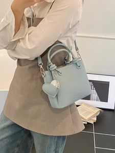 Light blue lychee pattern bucket bag with top handles and heart pendant charm