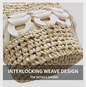 Detailed view of handmade woven straw bucket bag with white chain link decoration