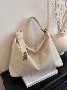 Minimalist off-white pleated tote bag with brown leather details and golden D-ring