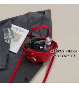 Detailed interior of red pebbled leather bucket bag showing large storage capacity