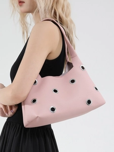 Pink leather hobo shoulder bag with silver eyelets and a wide strap for women