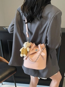 Pink lychee texture bucket bag with silver chain strap and cute bear plush charm