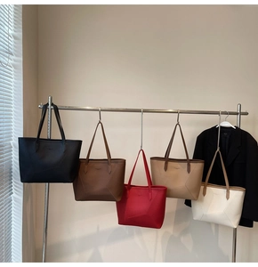 Detail view of large tote bags in five colors with geometric stitching for commuting