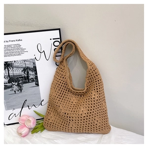 Detail of hand-woven hollow bucket bag with knit texture for summer beach vacation
