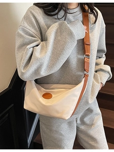 Chic beige nylon crescent crossbody bag with adjustable brown strap and logo detail
