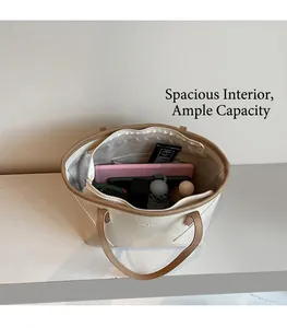 Spacious tote bag interior showing capacity for tablet, umbrella, and skincare essentials