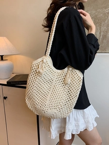 Chic cream woven tote bag with fringe tassels and crochet hollow out knit design