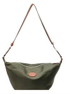 Olive green minimalist nylon crescent crossbody bag with brown leather shoulder strap
