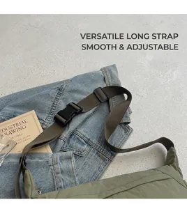 Detail of green nylon crossbody bag showing the adjustable brown strap and buckle closure