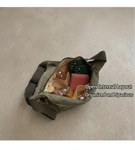 Internal view of the army green crossbody bag showing pockets and spacious storage