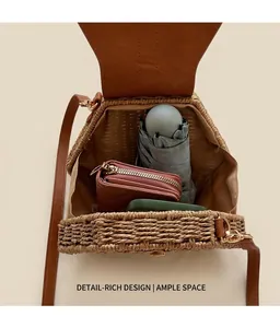 Interior view of straw crossbody bag showing storage for a long wallet and folding umbrella