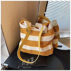 Macro shot of yellow and white striped knit texture and adjustable leather strap