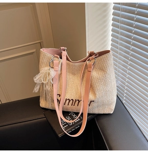Detailed straw tote bag with Summer embroidery, pink leather straps and pearl bow charm