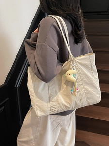 Minimalist off-white canvas tote bag with large capacity and yellow moon plush pendant