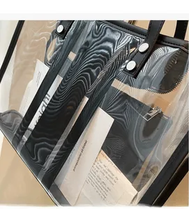 Detail view of transparent tote bag with black trim and inner pouch showing water ripple texture
