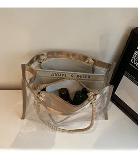 Spacious interior of clear PVC tote bag with removable inner pouch and braided handles