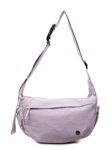 Light purple crescent crossbody bag in lightweight nylon fabric with adjustable buckle