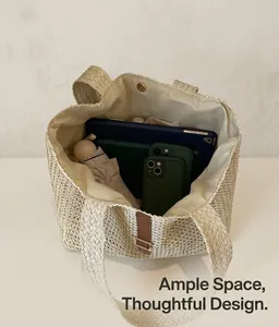 Detail view of large straw tote bag interior with magnetic snap and ample storage space