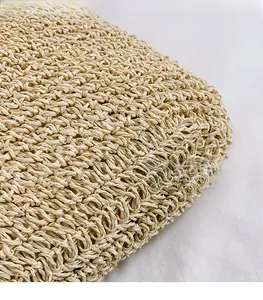 Macro shot of high-quality hand-woven straw texture on a summer beige tote bag