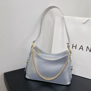Detail of silver matte shoulder bag with gold chain and FASHION & BAGS leather logo