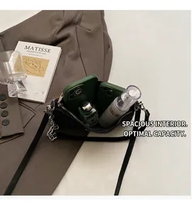 Detail shot showing the large interior capacity of the black leather crossbody bag