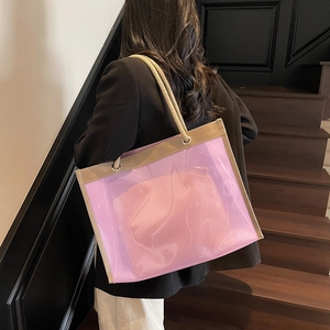 Purple transparent PVC tote bag with thick rope handles and pink inner pouch