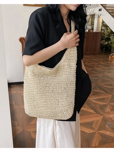 Large capacity beige straw woven shoulder bag for summer featuring an elegant crochet design