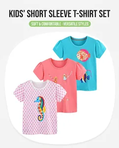 Détail de trois t-shirts en coton pour filles avec des imprimés de poissons et fées colorés