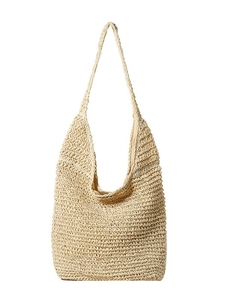 Large beige woven straw tote bag with integrated shoulder strap for summer beach travel