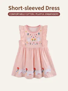 Close-up of pink striped cotton dress featuring detailed rabbit and flower embroidery