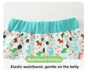 Detail of elastic ribbed waistband on toddler shorts with cute dinosaur and horse prints