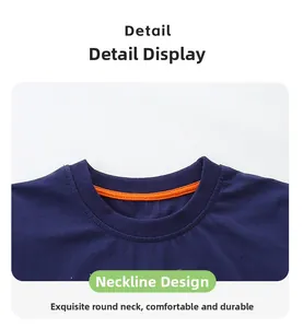 Detail view of the navy blue t-shirt neckline with bright orange contrast piping