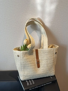 Large capacity beige woven straw tote bag with brown leather strap and metal buckle
