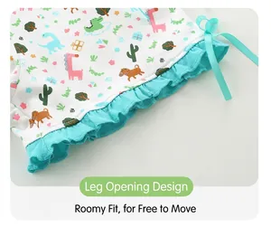Detailed view of kids cotton shorts with ruffles, ribbon bow and colorful cartoon print