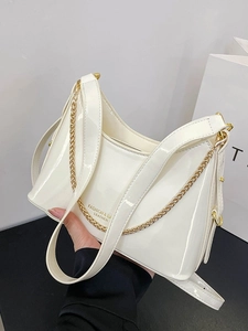 White glossy leather bucket bag with gold chain and fashion lettering print for women