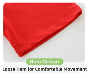 Detail view of red knitted cotton shorts hem with double-needle stitching and loose fit