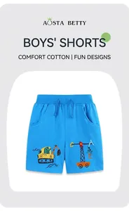 Dettaglio dei pantaloncini in cotone da bambino con ricamo scavatrice e coulisse