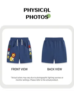 Front and back view of blue boys' knit shorts with cartoon lion and colorful embroidery