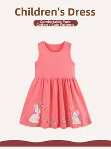 Close-up of bunny and floral embroidery on pink polka dot cotton girl's dress