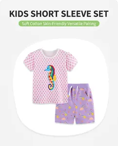 Detail of pink cotton T-shirt with sea horse print and purple rainbow shorts set