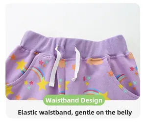 Detail of purple toddler pants with elastic waistband, white drawstring, and rainbow patterns