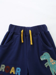 Kids navy knit shorts with green dinosaur embroidery and yellow drawstring detail