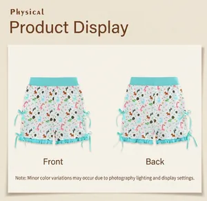 Front and back view of girls cotton shorts with dinosaur print and blue ribbon bows