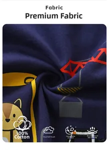 Close-up of soft 100% cotton fabric with cartoon construction truck print on navy blue