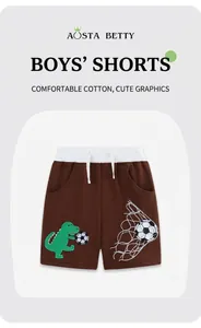 Détail d'un short en coton marron pour garçon avec taille élastique et broderie dinosaure