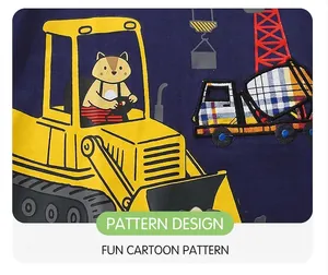 Detail of cartoon excavator and colorful patchwork cement mixer on navy blue boy's shirt