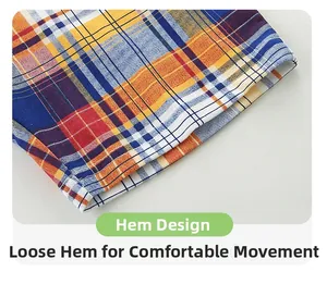 Close-up of classic yellow and blue plaid shorts featuring precise hem stitching details