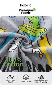 Close-up of soft grey cotton fabric with a vibrant green dinosaur astronaut print