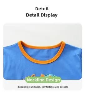 Detail of boys' blue cotton T-shirt with orange ribbed neckline and cartoon print