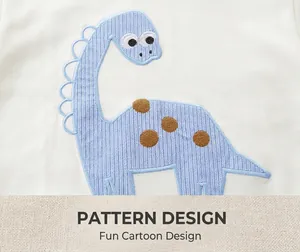 Close-up of a blue dinosaur embroidery patch on a white cotton kids short sleeve t-shirt